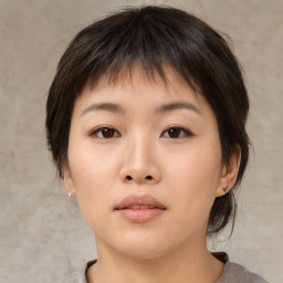 Neutral asian young-adult female with medium  brown hair and brown eyes