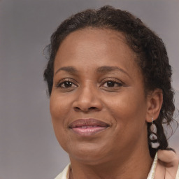 Joyful black adult female with short  brown hair and brown eyes