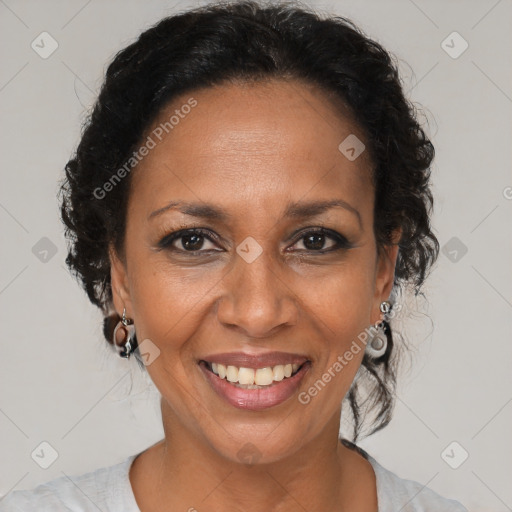 Joyful black adult female with medium  brown hair and brown eyes