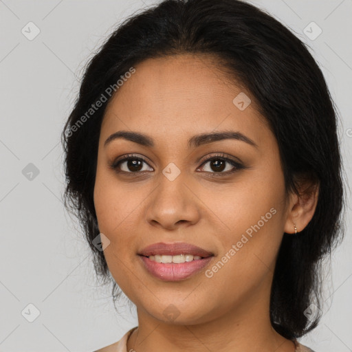 Joyful latino young-adult female with medium  brown hair and brown eyes