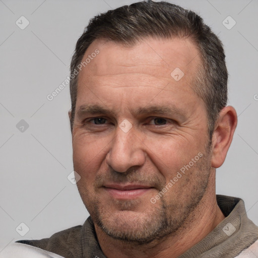 Joyful white adult male with short  brown hair and brown eyes