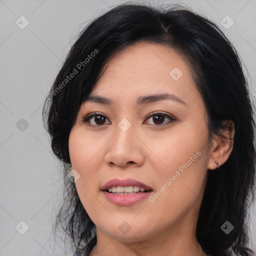 Joyful asian young-adult female with medium  black hair and brown eyes