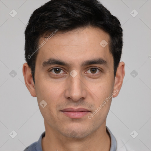 Joyful white young-adult male with short  black hair and brown eyes