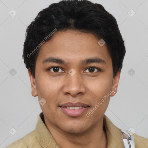 Joyful latino young-adult male with short  black hair and brown eyes