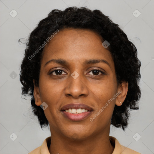 Joyful black young-adult female with medium  brown hair and brown eyes