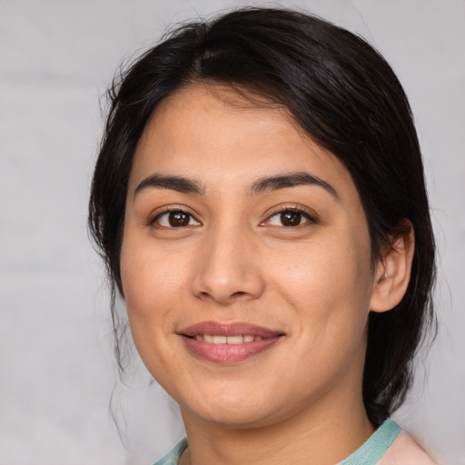 Joyful asian young-adult female with medium  brown hair and brown eyes