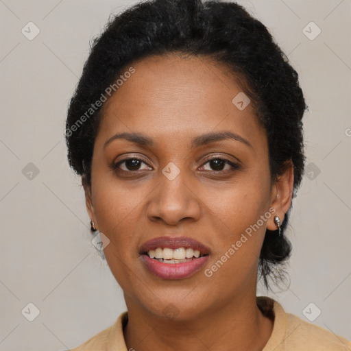 Joyful black adult female with short  black hair and brown eyes