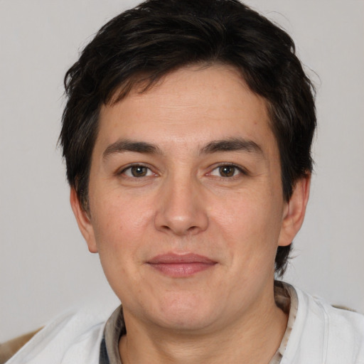 Joyful white adult male with short  brown hair and brown eyes