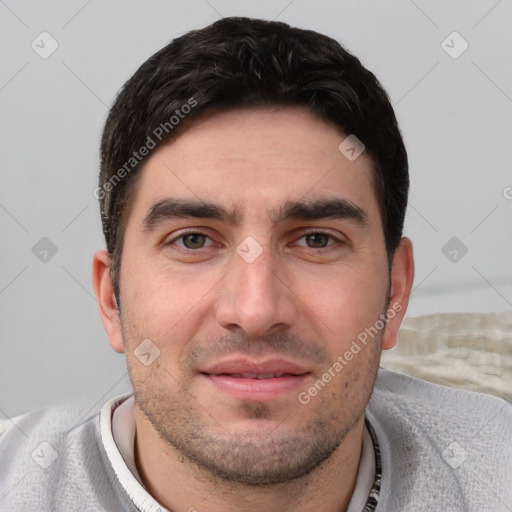 Joyful white young-adult male with short  black hair and brown eyes