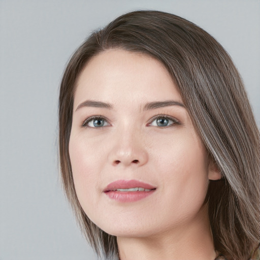 Joyful white young-adult female with medium  brown hair and blue eyes