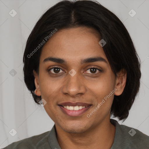 Joyful black young-adult female with medium  brown hair and brown eyes