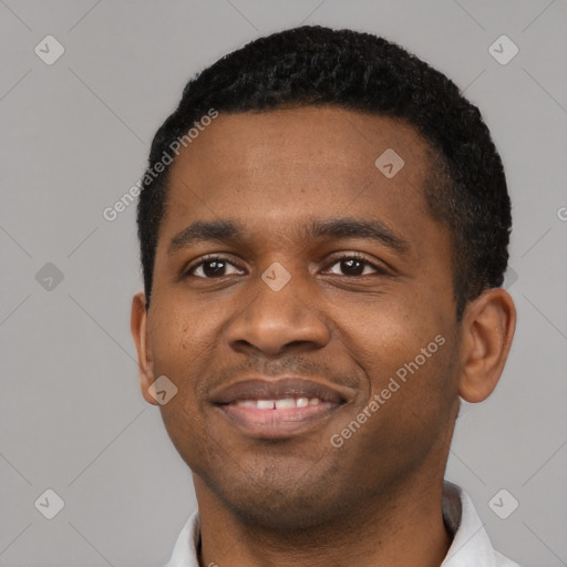 Joyful black young-adult male with short  black hair and brown eyes