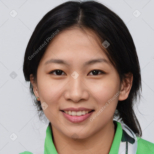 Joyful asian young-adult female with medium  brown hair and brown eyes