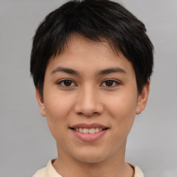 Joyful asian young-adult female with short  brown hair and brown eyes