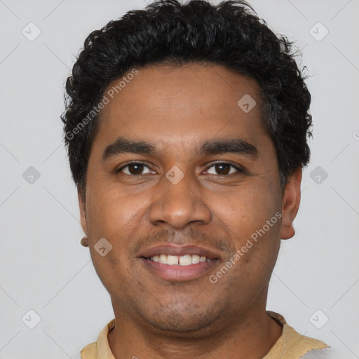 Joyful black young-adult male with short  black hair and brown eyes