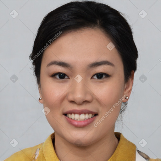 Joyful asian young-adult female with short  brown hair and brown eyes