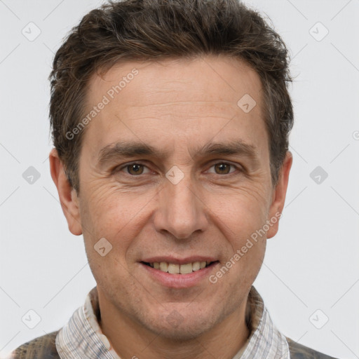 Joyful white adult male with short  brown hair and brown eyes