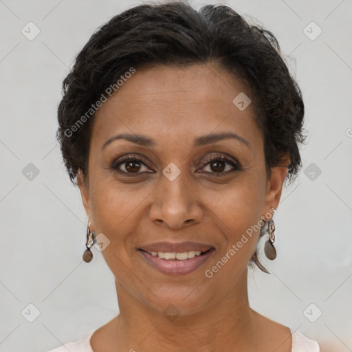 Joyful black adult female with short  brown hair and brown eyes