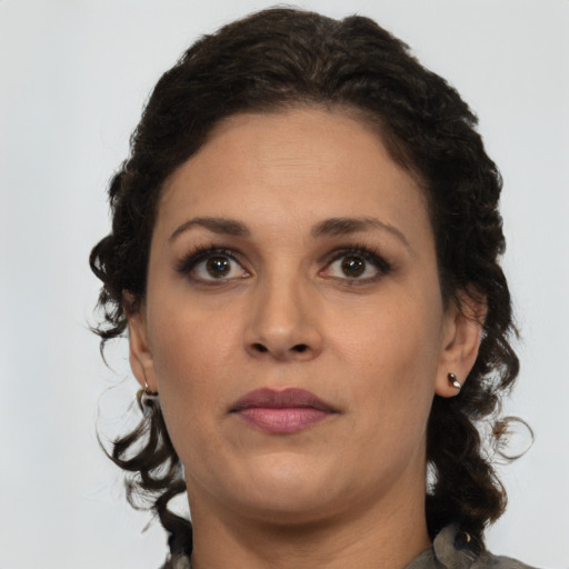 Neutral latino young-adult female with medium  brown hair and brown eyes