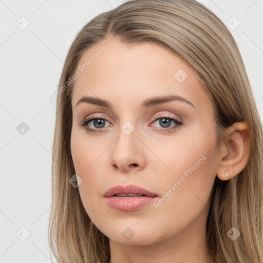 Neutral white young-adult female with long  brown hair and brown eyes