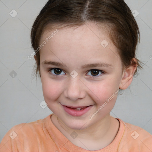 Joyful white child female with short  brown hair and brown eyes