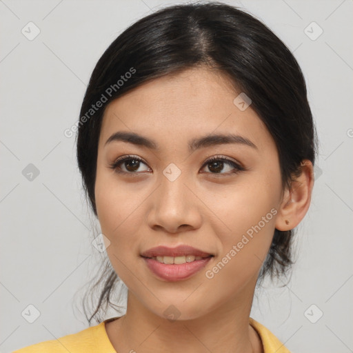 Joyful latino young-adult female with medium  black hair and brown eyes