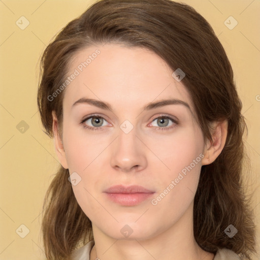 Neutral white young-adult female with long  brown hair and brown eyes