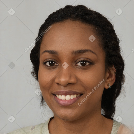 Joyful black young-adult female with medium  black hair and brown eyes