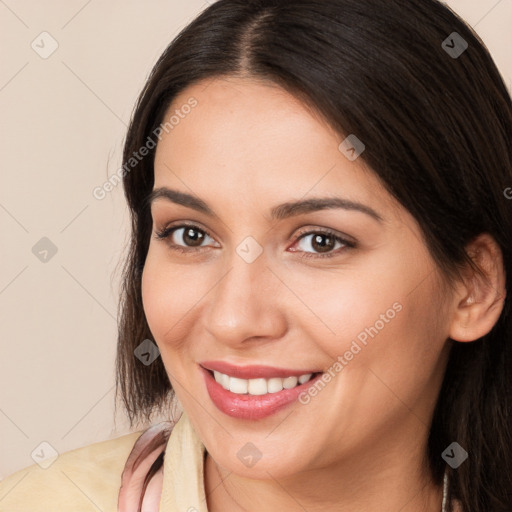 Joyful white young-adult female with long  brown hair and brown eyes