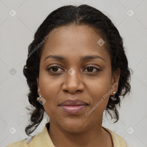 Joyful black adult female with medium  brown hair and brown eyes