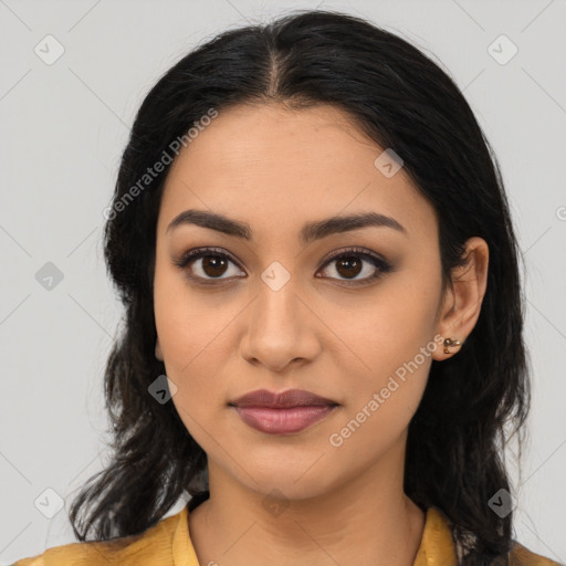 Joyful latino young-adult female with long  black hair and brown eyes