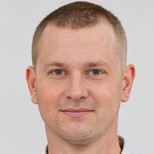 Joyful white adult male with short  brown hair and brown eyes