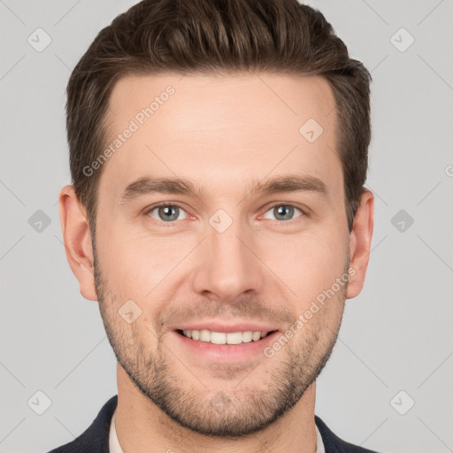 Joyful white young-adult male with short  brown hair and grey eyes