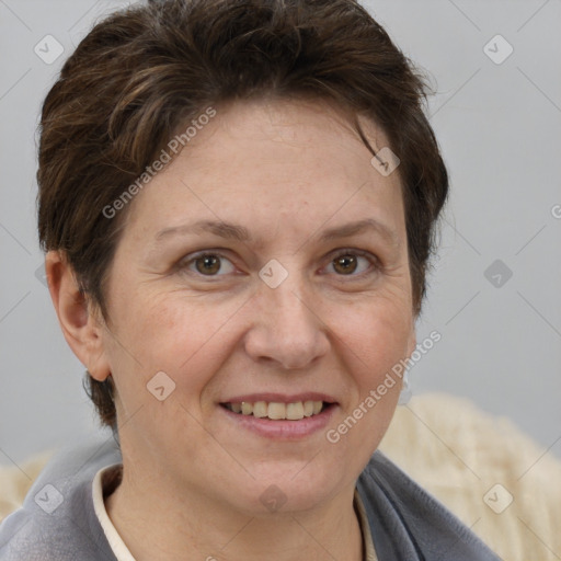 Joyful white adult female with short  brown hair and grey eyes