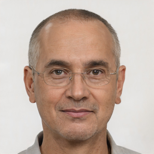 Joyful white adult male with short  gray hair and brown eyes