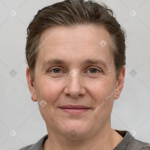 Joyful white adult male with short  brown hair and grey eyes