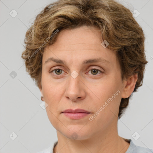 Joyful white adult female with short  brown hair and grey eyes