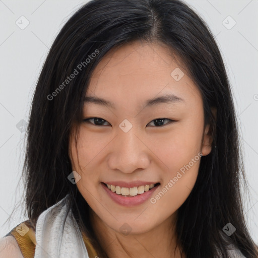 Joyful asian young-adult female with long  brown hair and brown eyes