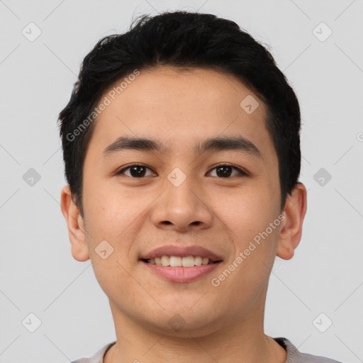 Joyful asian young-adult male with short  black hair and brown eyes