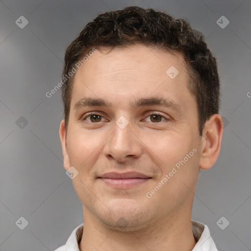 Joyful white young-adult male with short  brown hair and brown eyes