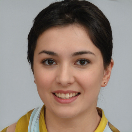 Joyful white young-adult female with medium  brown hair and brown eyes