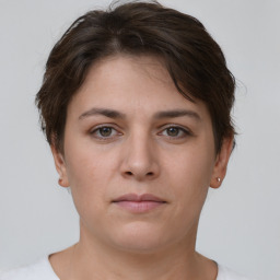 Neutral white young-adult female with short  brown hair and brown eyes