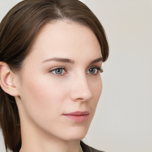 Neutral white young-adult female with medium  brown hair and grey eyes