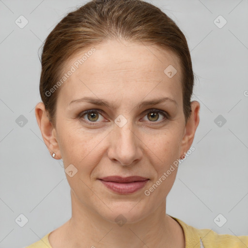 Joyful white adult female with short  brown hair and grey eyes