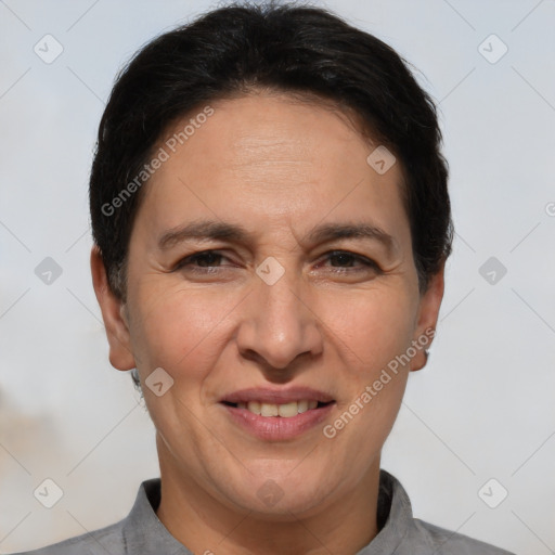 Joyful white adult female with short  brown hair and brown eyes