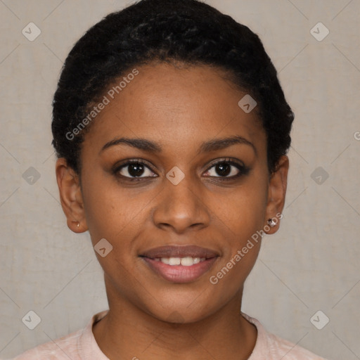 Joyful black young-adult female with short  black hair and brown eyes