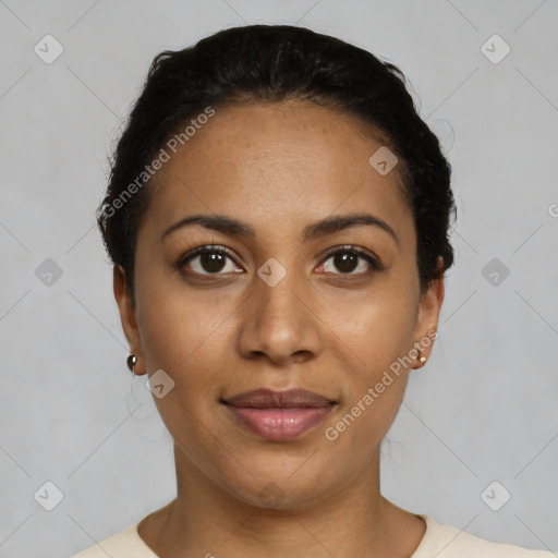 Joyful latino young-adult female with short  black hair and brown eyes