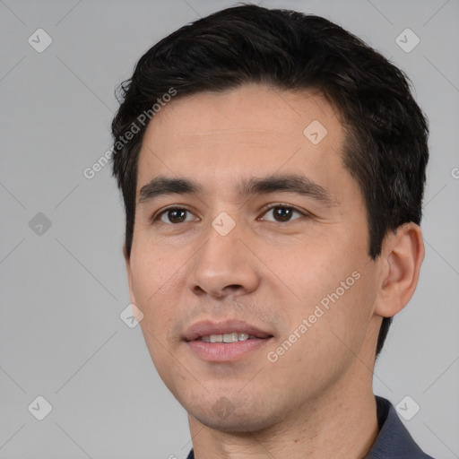 Joyful white young-adult male with short  black hair and brown eyes