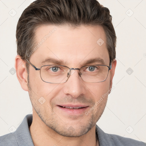 Joyful white adult male with short  brown hair and grey eyes