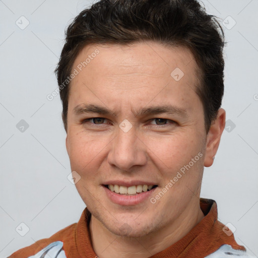 Joyful white adult male with short  brown hair and brown eyes